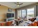 Cozy living room featuring water views, comfortable seating, and a ceiling fan at 163 Brent Cir, Oldsmar, FL 34677