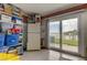 Well-organized storage room with shelving, refrigerator, and sliding door, ideal for functionality at 163 Brent Cir, Oldsmar, FL 34677