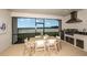 Outdoor lanai with a full kitchen, outdoor dining, and a scenic lake view at 1633 Trailhead Ln, Zephyrhills, FL 33541