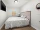 Cozy bedroom featuring a comfortable bed with white bedding, a wooden headboard, and a window for natural light at 1752 42Nd S St, St Petersburg, FL 33711