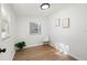 Bright bedroom with hardwood floors, minimalist decor, and a large window at 1752 42Nd S St, St Petersburg, FL 33711