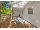 Side view of the carport featuring a concrete slab and an adjacent fence at 1752 42Nd S St, St Petersburg, FL 33711
