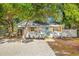 Charming single-story home with a gravel yard and light blue front door at 1752 42Nd S St, St Petersburg, FL 33711