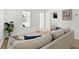 Bright living room features a comfortable sofa, a charming window display, and minimalist modern decor at 1752 42Nd S St, St Petersburg, FL 33711