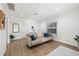 Cozy living room featuring neutral tones, hardwood floors, and a comfortable sofa with blue pillows at 1752 42Nd S St, St Petersburg, FL 33711