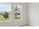 Bright bedroom with large windows offering a view of the outdoors at 17555 Glistening Ct, Venice, FL 34293