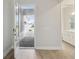 Inviting entryway with luxury vinyl plank flooring and a view to the bathroom at 17555 Glistening Ct, Venice, FL 34293