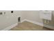 Functional laundry room with a utility sink and hookups for a washer and dryer at 17555 Glistening Ct, Venice, FL 34293