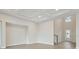 Bright living room with hardwood floors, coffered ceilings, and plenty of natural light at 17555 Glistening Ct, Venice, FL 34293