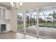 Eat-in kitchen leading to screened-in patio and pool area via sliding glass doors at 17555 Glistening Ct, Venice, FL 34293