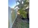 View of fenced-in yard with mature trees at 1782 Michigan Ne Ave, St Petersburg, FL 33703