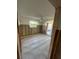 Spacious bedroom features ceramic tile flooring, window with wooded view and access to a patio at 1782 Michigan Ne Ave, St Petersburg, FL 33703