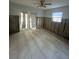 Spacious bedroom with ceramic tile flooring features large windows and glass paneled patio door at 1782 Michigan Ne Ave, St Petersburg, FL 33703