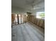 Spacious bedroom features gray ceramic tile, partial walls, and large window with neighborhood views at 1782 Michigan Ne Ave, St Petersburg, FL 33703