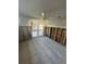 Spacious bedroom features ceramic tile flooring, partial walls and glass paneled patio door at 1782 Michigan Ne Ave, St Petersburg, FL 33703