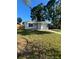 Charming single-story home with a well-maintained lawn and a convenient attached garage and front yard at 1782 Michigan Ne Ave, St Petersburg, FL 33703