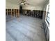 Large living room with tiled floors and exposed studs, offering a blank canvas for remodeling at 1782 Michigan Ne Ave, St Petersburg, FL 33703