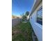 Side yard view of home with fenced in yard at 1782 Michigan Ne Ave, St Petersburg, FL 33703