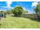 Large, well-maintained backyard featuring a lush green lawn and mature bamboo along the fence at 1857 N Belleair N Rd, Clearwater, FL 33764