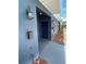 Close-up of townhome entrance, highlighting the dark blue front door, mailbox, and house number at 1935 Oxnard Ct, Tampa, FL 33612