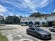Exterior shot of multi-Gathering residences with a parking lot and blue skies at 1935 Oxnard Ct, Tampa, FL 33612