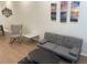 The living room features modern furniture including a couch and rocking chair with wood-look flooring at 1935 Oxnard Ct, Tampa, FL 33612