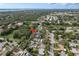 An aerial shot of a neighborhood showcasing the property's location amongst lush greenery and nearby amenities at 1949 Kings Hwy, Clearwater, FL 33755