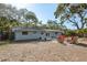 Inviting backyard featuring a patio with furniture and french doors that lead inside at 1949 Kings Hwy, Clearwater, FL 33755