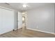 Cozy bedroom featuring wood-look floors, closet, and neutral paint at 1949 Kings Hwy, Clearwater, FL 33755