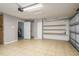 Spacious garage with tile flooring and plenty of storage shelves at 1949 Kings Hwy, Clearwater, FL 33755