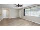 Bright living room with wood-look flooring and neutral decor at 1949 Kings Hwy, Clearwater, FL 33755