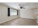 Inviting living room with a ceiling fan and large window at 1949 Kings Hwy, Clearwater, FL 33755