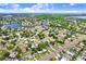 Aerial view shows home location within the neighborhood, community, and waterways in the distance at 201 83Rd N Ave, St Petersburg, FL 33702