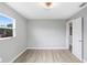 Bright bedroom features a neutral palette, wood-look flooring, and a modern ceiling fan for a serene retreat at 201 83Rd N Ave, St Petersburg, FL 33702