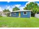 Classic home with a bright yellow door and well-maintained lawn, offering a welcoming feel at 201 83Rd N Ave, St Petersburg, FL 33702