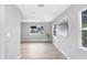 Open-concept living room showcases hardwood floors and large windows at 201 83Rd N Ave, St Petersburg, FL 33702