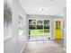Bright room with modern floors features a full lite door leading to the backyard at 201 83Rd N Ave, St Petersburg, FL 33702