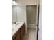 Bathroom with double vanity and tile floors at 20101 Oakflower Ave, Tampa, FL 33647