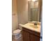 Bathroom featuring a vanity with sink, toilet, and glass-door shower at 20101 Oakflower Ave, Tampa, FL 33647