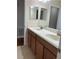 Bathroom with double sink vanity and tile floors at 20101 Oakflower Ave, Tampa, FL 33647