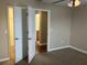 Bedroom with carpet and view of attached bathroom at 20101 Oakflower Ave, Tampa, FL 33647