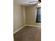 Bedroom with carpet, fan, and a window with black curtains at 20101 Oakflower Ave, Tampa, FL 33647