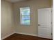 Bedroom featuring wood floors, a bright window, and neutral walls at 20101 Oakflower Ave, Tampa, FL 33647