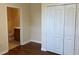 Bedroom featuring wood floors, a closet, and neutral walls at 20101 Oakflower Ave, Tampa, FL 33647