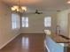 Open kitchen with wood floors, granite countertops, and stainless steel sink at 20101 Oakflower Ave, Tampa, FL 33647