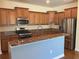 Kitchen featuring stainless steel appliances, granite countertops, and a breakfast bar at 20101 Oakflower Ave, Tampa, FL 33647