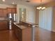 Kitchen features stainless steel appliances, granite countertops, and a breakfast bar at 20101 Oakflower Ave, Tampa, FL 33647