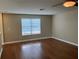 Bright living room featuring hardwood floors, natural light, and neutral walls at 20101 Oakflower Ave, Tampa, FL 33647