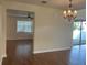 Well-lit living room with hardwood floors leads to the outdoor patio at 20101 Oakflower Ave, Tampa, FL 33647