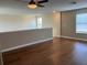 Loft space with hardwood floors and neutral colored walls, illuminated by natural light at 20101 Oakflower Ave, Tampa, FL 33647